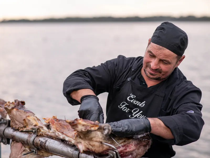 Carving the spit roast at an event